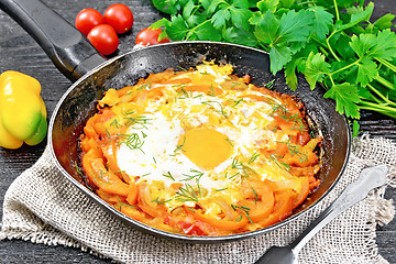 Image showing Scrambled eggs with vegetables in pan on board