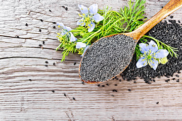 Image showing Flour of kalingi in spoon with flower on board top