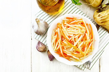 Image showing Salad of parsnip and carrot on board top