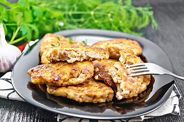 Image showing Fritters meat in black plate on board