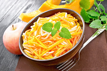 Image showing Salad of pumpkin and apple in bowl on table