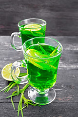 Image showing Lemonade Tarragon in two goblets on wooden board