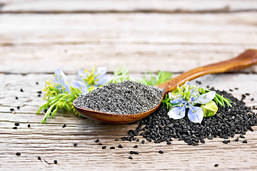 Image showing Flour of kalingi in spoon with flower on board