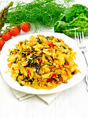 Image showing Cabbage stew with chard in plate on light wooden board