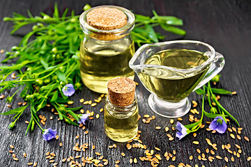 Image showing Oil flaxseed on wooden board