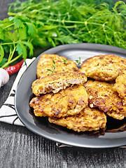 Image showing Fritters meat in black plate on dark board