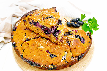 Image showing Pie with black grapes on white board