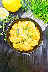 Image showing Gnocchi pumpkin in bowl on dark wooden board top