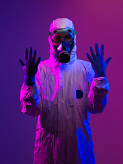 Image showing Doctor wearing protective biological suit and mask due to corona