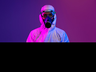 Image showing Doctor wearing protective biological suit and mask due to corona