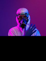 Image showing Doctor wearing protective biological suit and mask due to corona