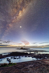 Image showing Starry night sky just before sunrise of coastal landscape