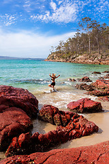 Image showing Woman playing in ocean paradise beach travel destination