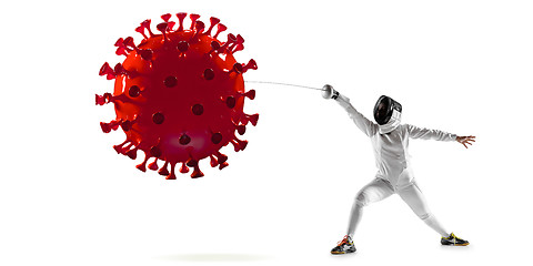 Image showing Professional sportswoman kicking, punching coronavirus model - fight the desease, flyer