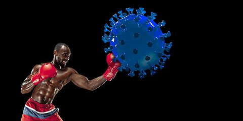 Image showing Professional sportsman kicking, punching coronavirus model - fight the desease, flyer