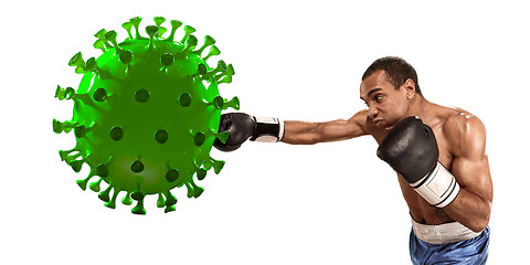 Image showing Professional sportsman kicking, punching coronavirus model - fight the desease, flyer