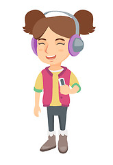 Image showing Caucasian girl listening to music in headphones.