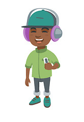 Image showing African boy listening to music in headphones.