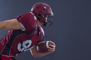 Image showing American football Player running with the ball