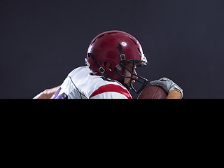 Image showing American football Player running with the ball