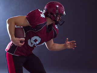 Image showing American football Player running with the ball