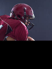 Image showing American football Player running with the ball