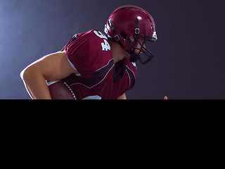 Image showing American football Player running with the ball