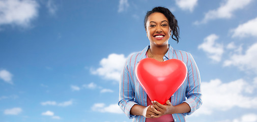 Image showing african american woman with heart-shaped balloon