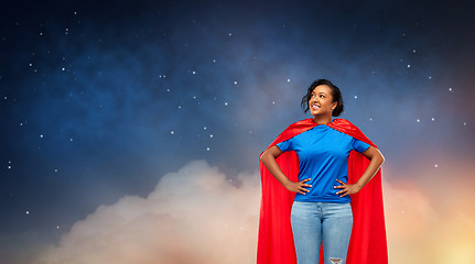 Image showing happy african american woman in superhero red cape