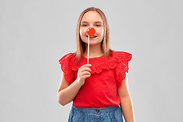 Image showing beautiful smiling girl in red shirt and skirt