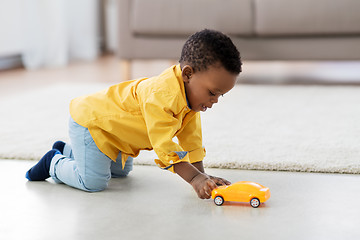 Image showing african american baby boy playing with toy car