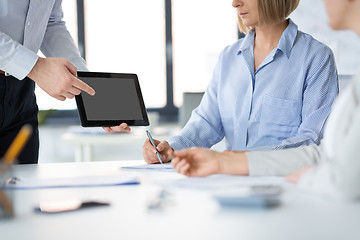 Image showing close up of business team with tablet pc at office