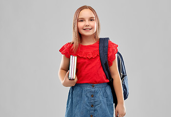 Image showing smiling student girl with books and bag