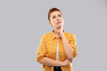 Image showing red haired teenage girl looking up and dreaming