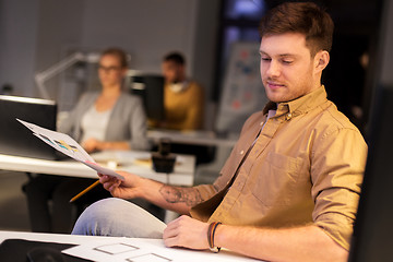 Image showing designer or software developer at night office