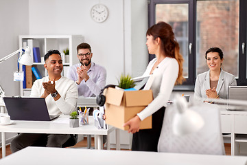 Image showing colleagues applauding to new female office worker