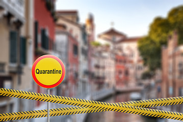 Image showing Forbidden sign of quarantine with crossing police lines on a blurred background of Grand Canal in Venice, Italy.