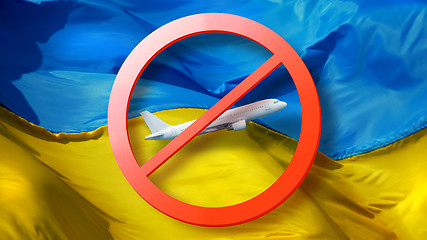 Image showing Close-up prohibition sign with crossed out white plane on the background of Ukrainian flag.