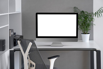 Image showing Modern office working space with mock up computer screen.