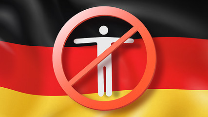 Image showing Warning sign with crossed out man on a background German flag.