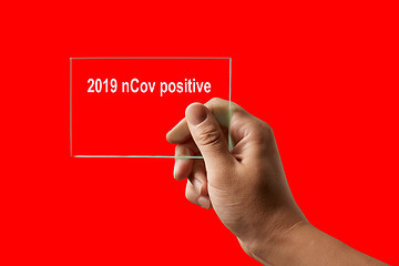 Image showing Hand with positive test for 2019 nCov.