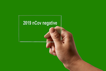 Image showing Hand with negative test for 2019 nCov.