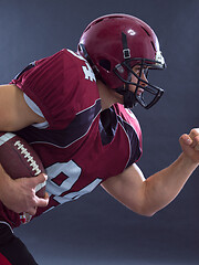 Image showing American football Player running with the ball