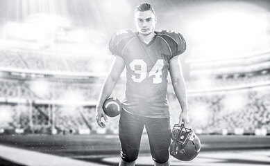 Image showing American Football Player isolated on big modern stadium field