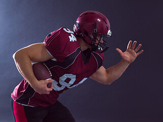 Image showing American football Player running with the ball