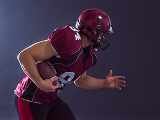 Image showing American football Player running with the ball