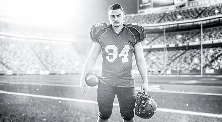 Image showing American Football Player isolated on big modern stadium field