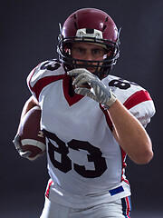 Image showing American football Player running with the ball