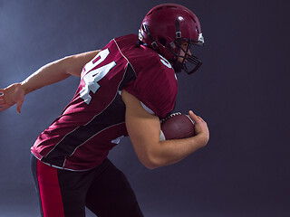 Image showing American football Player running with the ball