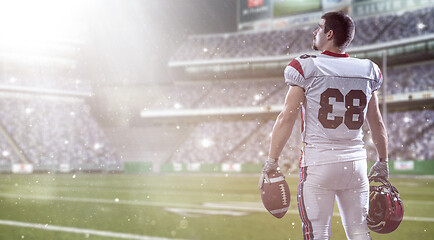 Image showing American Football Player isolated on big modern stadium field